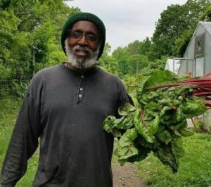 Malik Yakitini founder of D-town farm and now set to startup coop grocery store in Detroit. 